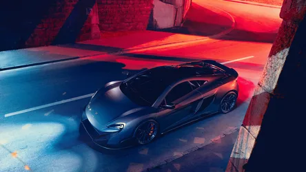 McLaren Sports Car in Neon-Lit Urban Garage - free wallpaper 3840×2160