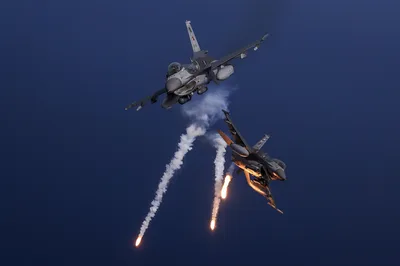 Fighter Jets in Aerial Combat Maneuver with Flares - free wallpaper 3000×1997