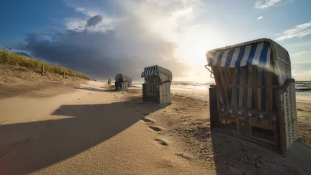 Beach Chairs at Sunset on German North Sea Coast - free wallpaper 6144×3456