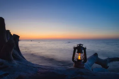 Lantern on Beach at Twilight with Driftwood - free wallpaper 5897×3931
