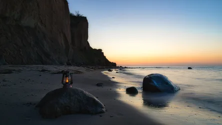 Sunset Beach With Lantern And Chalk Cliffs - free wallpaper 6144×3456