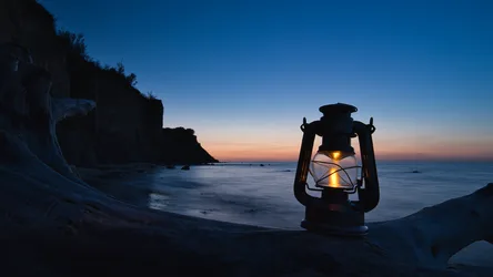 Lantern Glowing on Beach at Twilight - free wallpaper 6144×3456