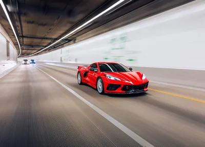 Red Sports Car Driving Through Modern Tunnel - free wallpaper 5818×4165