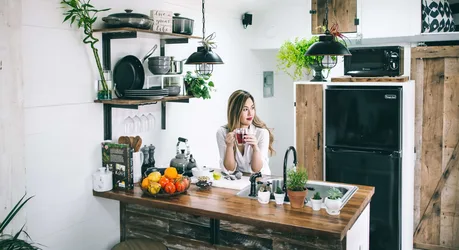 Woman in Modern Kitchen With Plants and Vintage Appliances - free wallpaper 5475×2979