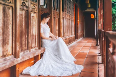 Bride in White Dress in Traditional Wooden Corridor - free wallpaper 2048×1365