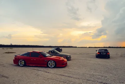 Sports Cars Parked on Empty Flat Terrain at Sunset - free cars & vehicles wallpaper 2048×1365