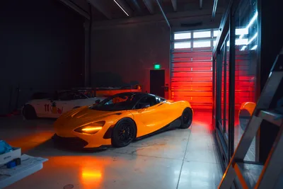 Orange Sports Car in Modern Neon-Lit Garage - free cars & vehicles wallpaper 2048×1365