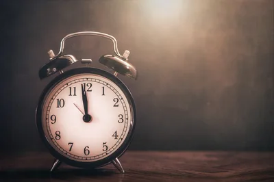 Vintage Alarm Clock Striking Midnight on Wooden Surface - free photography wallpaper 6018×4005