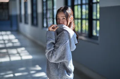Young Woman in Gray Sweater in Modern Corridor - free people & portraits wallpaper 3000×1992