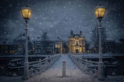 Snowy Winter Bridge to Illuminated Historic Town Square - free city & urban wallpaper 6144×4096