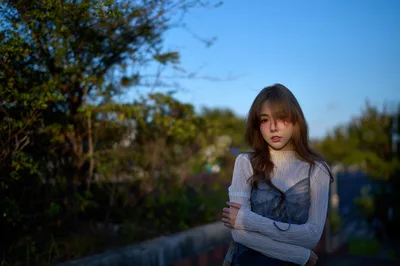 Young Woman in White Top by Garden Path at Sunset - free wallpaper 3000×1993