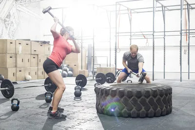 CrossFit Athletes Training with Sledgehammer and Tire - free people & portraits wallpaper 5644×3763