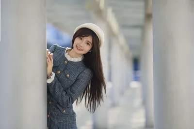 Asian Woman in Gray Coat Posing by White Column - free wallpaper 5120×3418