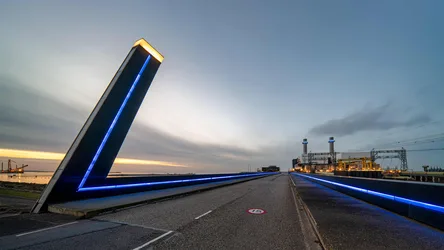 Illuminated Bridge Approach at Dusk Over Industrial Waterway - free city & urban wallpaper 6505×3661
