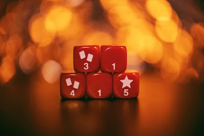 Red Dice with Numbers and Symbols on Warm Background - free photography wallpaper 5333×3555