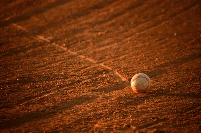 Baseball on Red Clay Diamond Field - free sports wallpaper 6000×3997