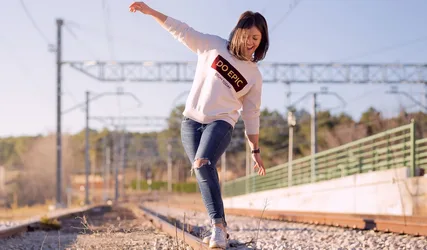 Woman Jumping on Railroad Tracks in White Sweatshirt - free people & portraits wallpaper 2048×1200