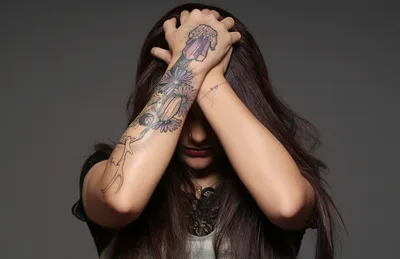 Woman With Extensive Arm Tattoos Covering Face - free wallpaper 2250×1455