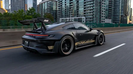 Black Porsche GT3 RS with Gold Accents on Urban Highway - free cars & vehicles wallpaper 2500×1406