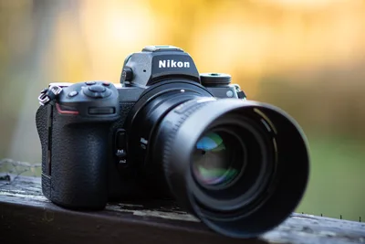 Nikon DSLR Camera on Wooden Surface - free technology wallpaper 4000×2667
