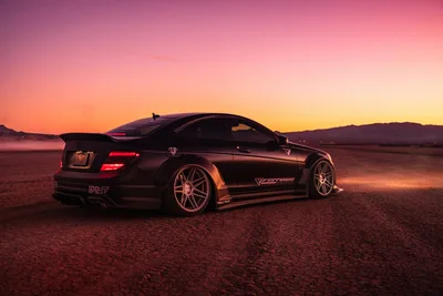 Black Sports Car at Desert Sunset - free cars & vehicles wallpaper 2048×1367