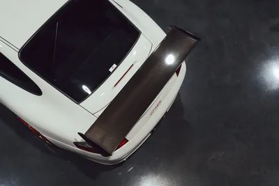 White Porsche 911 with Carbon Fiber Spoiler Overhead View - free wallpaper 2048×1365
