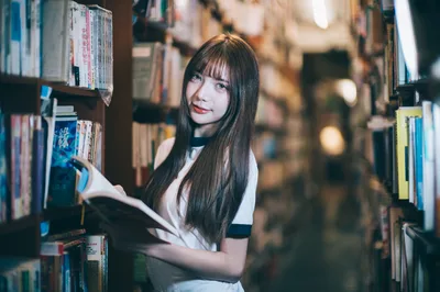 Woman Reading Book Between Library Shelves - free people & portraits wallpaper 3000×1992