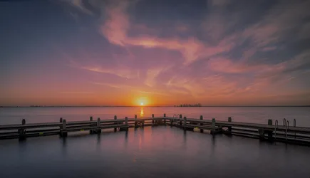 Wooden Pier at Sunrise Over Calm Water - free nature wallpaper 6144×3529