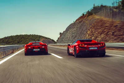 Two Red Sports Cars Racing on Mountain Highway - free cars & vehicles wallpaper 2048×1366