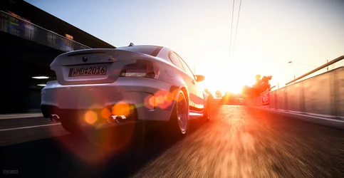 White BMW Sports Car Accelerating at Sunset - free wallpaper 4096×2121