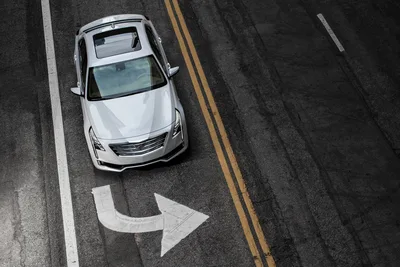 White Sedan on Road with Directional Arrow Marking - free cars & vehicles wallpaper 3000×2000