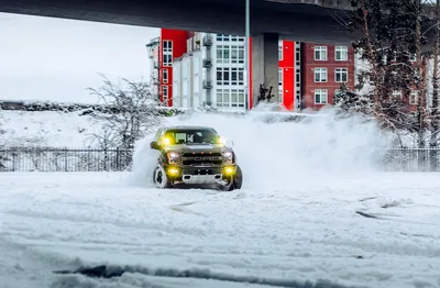 Ford Truck Plowing Through Deep Snow Near Red Building - free cars & vehicles wallpaper 5455×3579