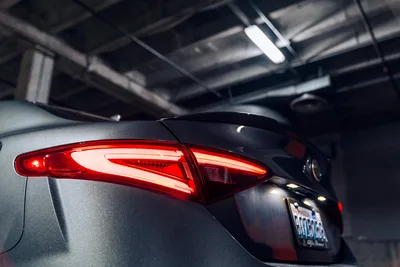 Modern Car Tail Light in Underground Parking Garage - free cars & vehicles wallpaper 6000×4000
