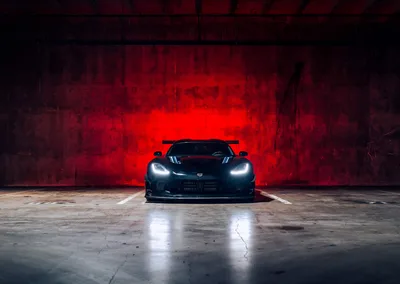 Black Sports Car Against Red Neon Wall - free cars & vehicles wallpaper 5560×3943