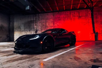 Black Sports Car In Red-Lit Industrial Warehouse - free cars & vehicles wallpaper 5926×3951