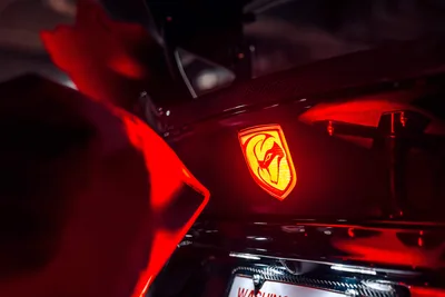 Illuminated Ferrari Badge on Red Sports Car - free cars & vehicles wallpaper 5325×3550