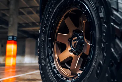 Bronze Alloy Wheel with Black Tire Close-Up - free cars & vehicles wallpaper 6000×4000