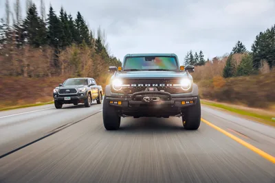 Ford Bronco Leading Convoy on Forest Highway - free cars & vehicles wallpaper 6720×4480