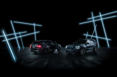 Two Luxury SUVs in Neon-Lit Modern Garage - free wallpaper 5300×3500