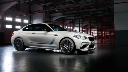 White BMW M2 with M-Sport Stripes in Industrial Garage - free cars & vehicles wallpaper 6000×3375