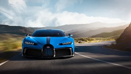 Blue Bugatti Chiron Sports Car on Mountain Road - free wallpaper 4500×2532
