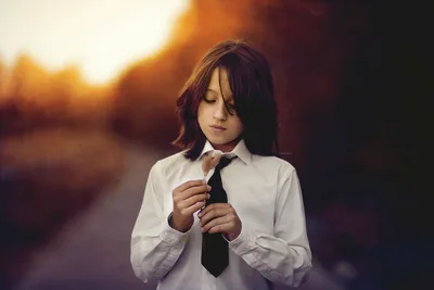 Young Girl in White Shirt and Tie Holding Dried Flower - free wallpaper 2048×1368