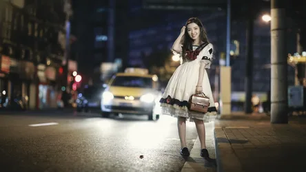Woman in Vintage Dress on City Street at Night - free wallpaper 2048×1152
