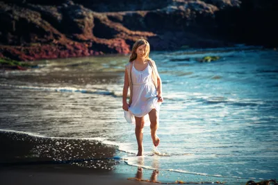 Woman in White Dress Walking Along Rocky Beach Shore - free people & portraits wallpaper 2048×1367