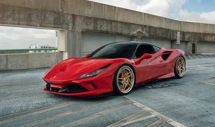 Red Ferrari Sports Car on Concrete Parking Structure - free wallpaper 6126×3632