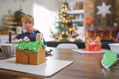 Gingerbread House Decorating Activity in Holiday Kitchen - free photography wallpaper 6016×4016