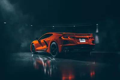 Orange Sports Car in Dark Industrial Garage - free cars & vehicles wallpaper 8256×5504