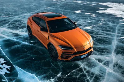 Orange Lamborghini Urus on Frozen Lake Ice - free cars & vehicles wallpaper 4000×2647