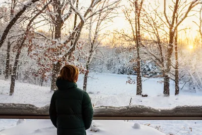 Person Watching Snowy Winter Landscape at Sunset - free wallpaper 6016×4016