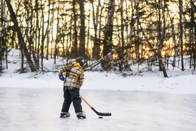 Young Hockey Player on Frozen Forest Pond - free wallpaper 6016×4016